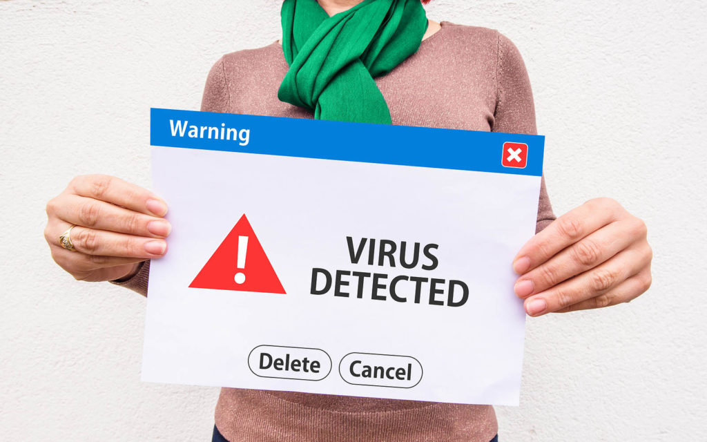 This spyware types graphic is an example of adware. It's an image of a woman holding a fake popup window warning "virus detected"